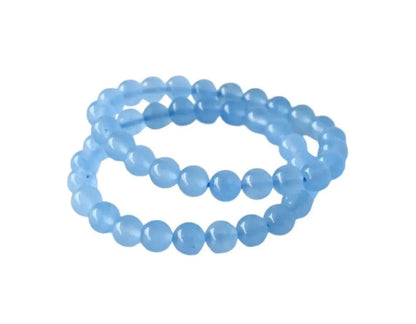Chalcedony Bracelet featuring healing blue beads crafted from natural crystal stones, designed as a stretch friendship bracelet for women and men. This handmade round beaded jewelry piece promotes calmness, emotional balance, and positive energy. Lightweight and comfortable, it makes a meaningful gift symbolizing connection and wellness. Perfect for everyday wear or spiritual practices, combining artisanal craftsmanship with the soothing beauty of chalcedony gemstones.