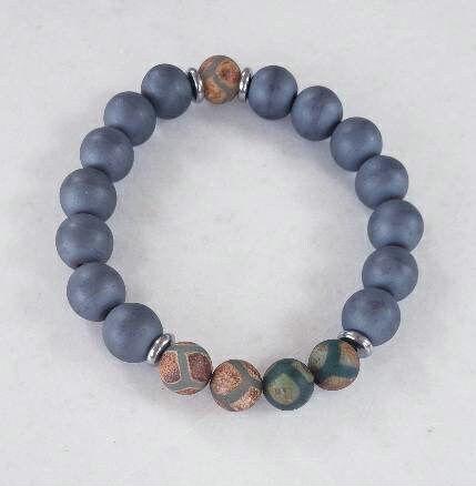 Gray Hematite Bracelet featuring Tibetan Agate accents, handcrafted as a crystal healing jewelry piece for men. This lucky charm bracelet combines the grounding energy of hematite with the protective properties of Tibetan agate, promoting balance and spiritual wellness. Lightweight and stylish, it makes a meaningful gift for him, perfect for everyday wear or meditation. Unique Tibetan-inspired design blends artisanal craftsmanship with natural healing stones.