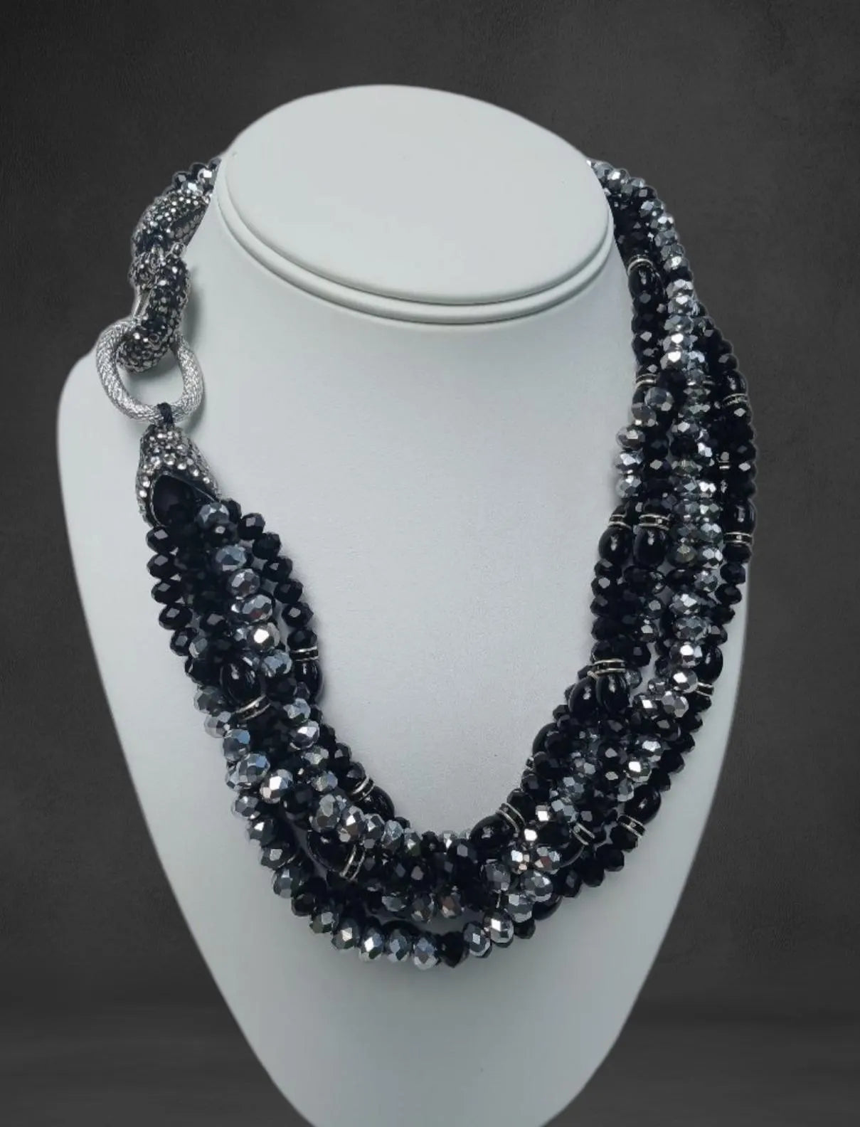 Bold chunky crystal statement necklace for women featuring multi-strand black design and handmade craftsmanship. This stylish choker adds a dramatic touch to any outfit, perfect for parties, events, or anniversary celebrations. Elegant and eye-catching, this costume jewelry piece is ideal as a unique gift for her. Designed to enhance confidence and style, this artisan necklace blends modern fashion with timeless sophistication.