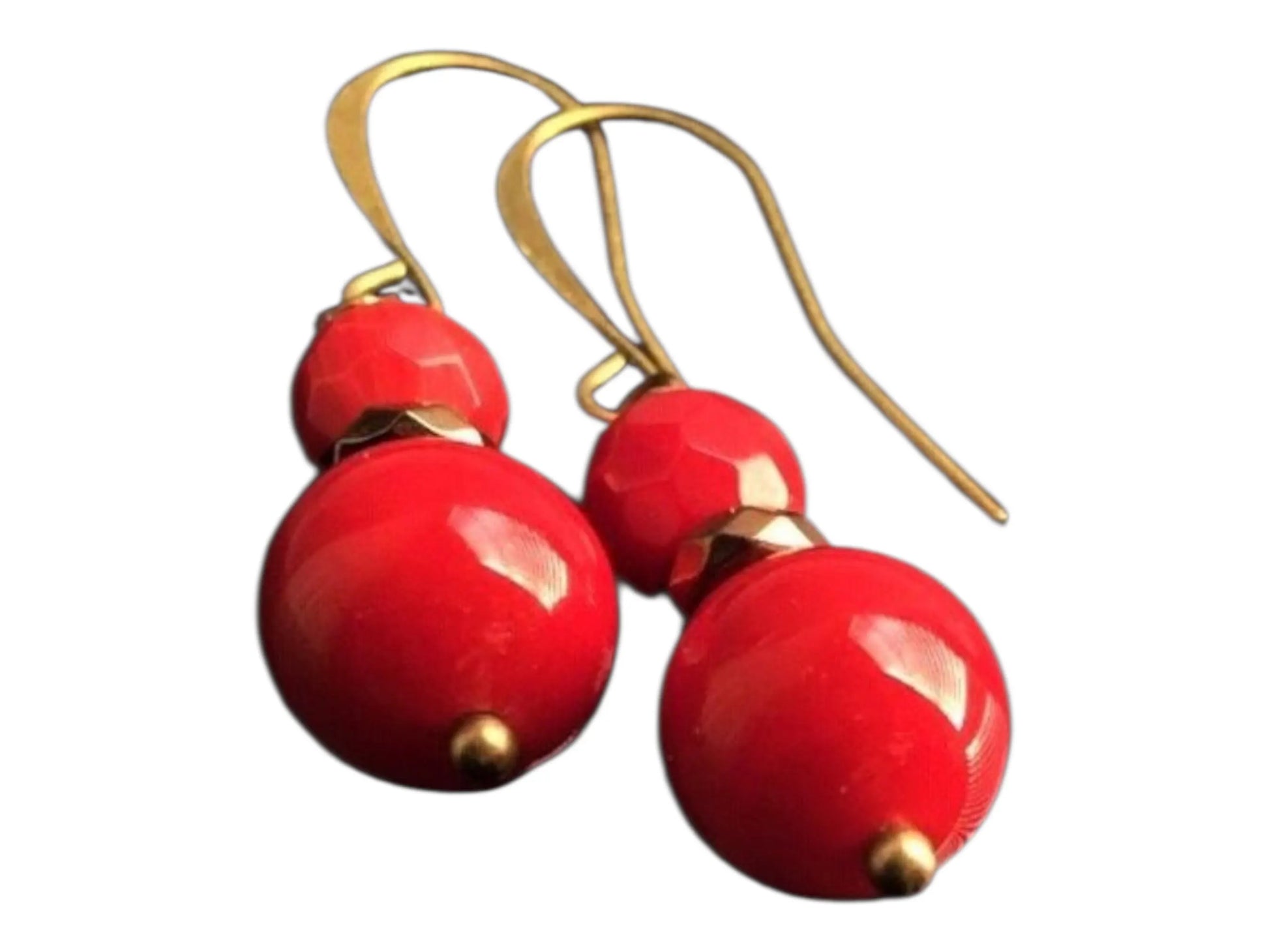Vintage Tibetan-style hoop earrings crafted with red coral, bronze accents, and red beaded agate stones combined with glass drops. These statement earrings for women feature intricate handcrafted design, blending bold colors and textures for a unique, eye-catching accessory. Perfect for adding a pop of vibrant color to any outfit, these earrings embody ethnic charm and timeless elegance, ideal for special occasions or everyday wear.
