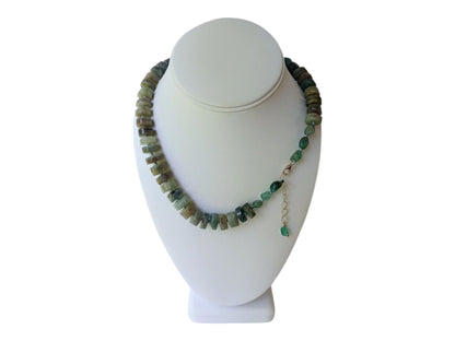 Green Emerald Gemstone Necklace featuring vibrant emerald and deep blue kyanite beads, handcrafted into a boho-inspired design with sterling silver accents. This elegant handmade necklace is perfect for women who appreciate unique, natural gemstone jewelry. Ideal gift for moms or special occasions, blending timeless style with spiritual energy. A stunning piece that complements both casual and formal looks, highlighting artisanal craftsmanship and meaningful stones.