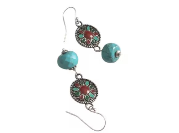 Turquoise Earrings featuring a Southwestern style with vibrant blue stones in a bold, handmade design inspired by Tibetan and Aztec jewelry. These boho statement earrings are perfect for women who love cultural patterns and earthy elegance. Lightweight and eye-catching, they make a meaningful gift for her on birthdays, holidays, or special occasions. A unique accessory that adds rustic charm and artisan style to any outfit.