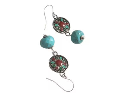 Turquoise Earrings featuring a Southwestern style with vibrant blue stones in a bold, handmade design inspired by Tibetan and Aztec jewelry. These boho statement earrings are perfect for women who love cultural patterns and earthy elegance. Lightweight and eye-catching, they make a meaningful gift for her on birthdays, holidays, or special occasions. A unique accessory that adds rustic charm and artisan style to any outfit.
