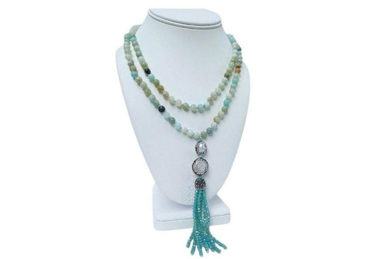 Amazonite and Pearl Necklace featuring handmade beaded crystals crafted into a bohemian long necklace with yoga charm beads and tassel accents. This unique jewelry piece blends soothing amazonite stones with elegant pearls, creating a versatile accessory perfect for spiritual practice or everyday wear. Lightweight and stylish, it makes a thoughtful gift for her, combining artisanal craftsmanship with calming energy and boho-chic design for women who appreciate meaningful jewelry.