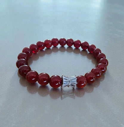 Carnelian bracelet featuring polished orange-red healing crystals on a handmade beaded strand. A vibrant energy-boosting crystal jewelry piece designed for women, ideal as a spiritual, healing, or meaningful gift.