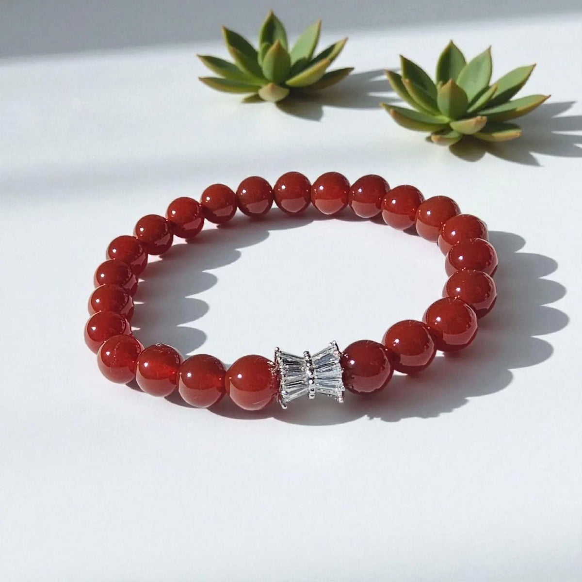 Carnelian bracelet featuring polished orange-red healing crystals on a handmade beaded strand. A vibrant energy-boosting crystal jewelry piece designed for women, ideal as a spiritual, healing, or meaningful gift.