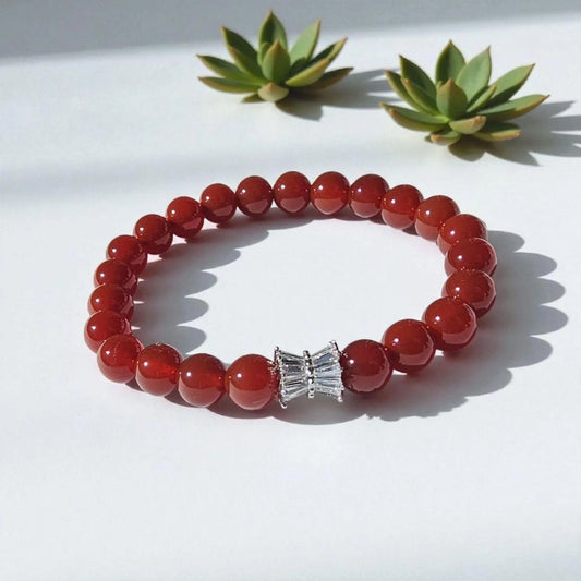 Carnelian bracelet featuring polished orange-red healing crystals on a handmade beaded strand. A vibrant energy-boosting crystal jewelry piece designed for women, ideal as a spiritual, healing, or meaningful gift.