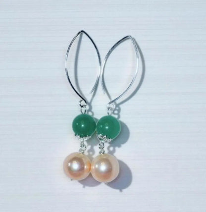 Green Aventurine Earrings with Freshwater Pearl Dangles handcrafted in sterling silver for an elegant, timeless look. These earrings feature natural green aventurine stones paired with lustrous freshwater pearls, symbolizing luck, prosperity, and calm energy. Perfect for adding a touch of sophistication to any outfit, they make a thoughtful gift for women who appreciate handmade gemstone jewelry, natural healing crystals, and classic accessories that blend beauty with spiritual balance.