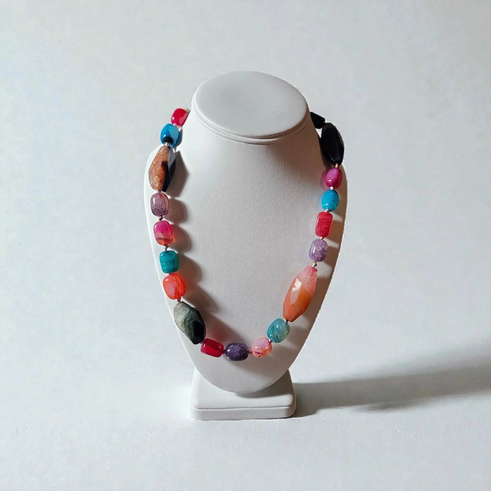 Chunky Multi-Color Agate Necklace handcrafted with vibrant natural agate stones in a bold statement design. This eye-catching jewelry piece combines colorful gemstones for a striking, boho-chic accessory perfect for casual wear, special occasions, or layering with other necklaces. Ideal as a thoughtful gift for women who love handmade statement jewelry, crystal healing properties, and artisan-crafted accessories that blend style, energy, and unique, colorful charm.