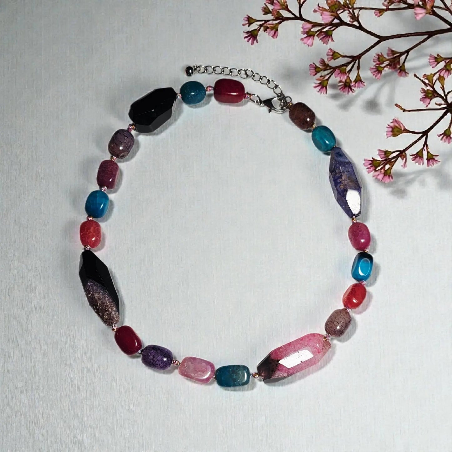 Chunky Multi-Color Agate Necklace handcrafted with vibrant natural agate stones in a bold statement design. This eye-catching jewelry piece combines colorful gemstones for a striking, boho-chic accessory perfect for casual wear, special occasions, or layering with other necklaces. Ideal as a thoughtful gift for women who love handmade statement jewelry, crystal healing properties, and artisan-crafted accessories that blend style, energy, and unique, colorful charm.