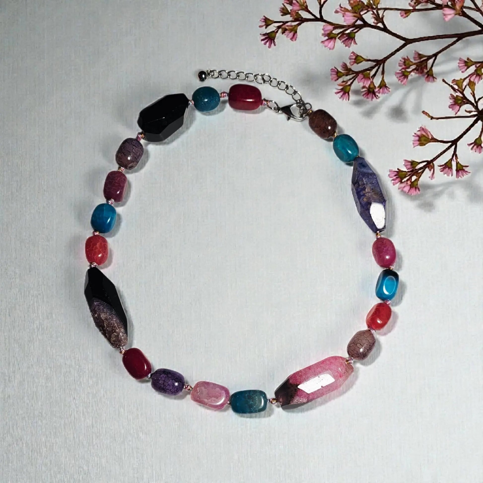 Chunky Multi-Color Agate Necklace handcrafted with vibrant natural agate stones in a bold statement design. This eye-catching jewelry piece combines colorful gemstones for a striking, boho-chic accessory perfect for casual wear, special occasions, or layering with other necklaces. Ideal as a thoughtful gift for women who love handmade statement jewelry, crystal healing properties, and artisan-crafted accessories that blend style, energy, and unique, colorful charm.