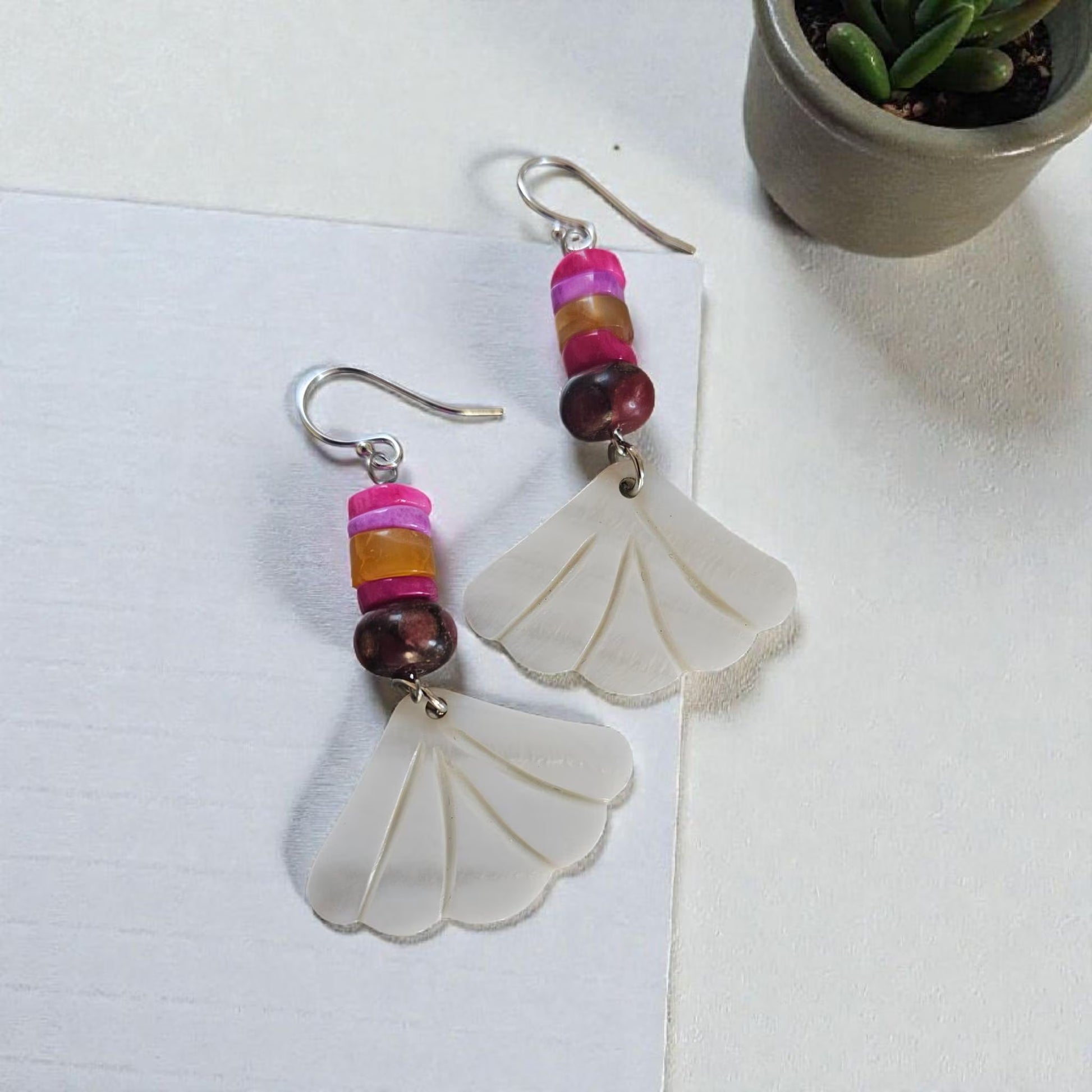 Peruvian Opal Dangle Earrings handcrafted in sterling silver, featuring soft aqua-blue opal stones with natural marbling. These boho-inspired earrings offer a lightweight, elegant drop design perfect for everyday wear or adding a calming pop of color to any outfit. Ideal for gemstone lovers and those who appreciate artisan jewelry, they make a thoughtful gift for women who enjoy unique, nature-inspired accessories with a relaxed, bohemian style.