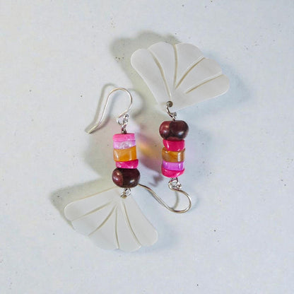 Peruvian Opal Dangle Earrings handcrafted in sterling silver, featuring soft aqua-blue opal stones with natural marbling. These boho-inspired earrings offer a lightweight, elegant drop design perfect for everyday wear or adding a calming pop of color to any outfit. Ideal for gemstone lovers and those who appreciate artisan jewelry, they make a thoughtful gift for women who enjoy unique, nature-inspired accessories with a relaxed, bohemian style.