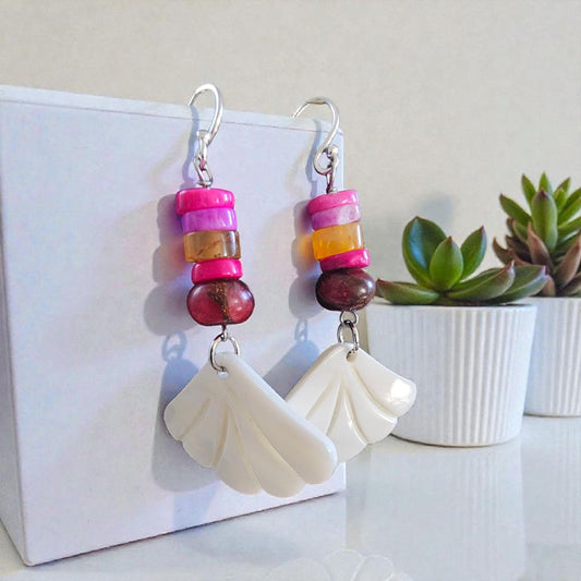 Peruvian Opal Dangle Earrings handcrafted in sterling silver, featuring soft aqua-blue opal stones with natural marbling. These boho-inspired earrings offer a lightweight, elegant drop design perfect for everyday wear or adding a calming pop of color to any outfit. Ideal for gemstone lovers and those who appreciate artisan jewelry, they make a thoughtful gift for women who enjoy unique, nature-inspired accessories with a relaxed, bohemian style.