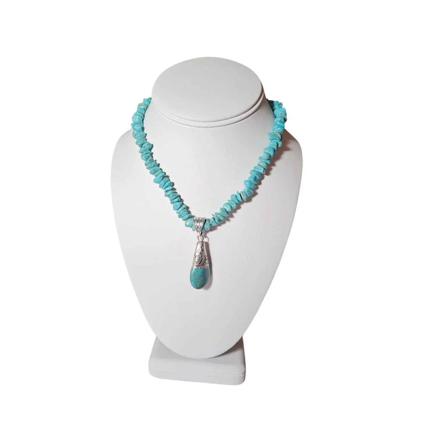 Turquoise Necklace featuring a handcrafted Tibetan turquoise pendant with contemporary repoussé design. This artisan necklace combines vibrant turquoise stones with intricate metalwork for a striking boho-chic statement piece. Perfect for everyday wear, festivals, or special occasions, it makes a thoughtful gift for women who love handcrafted jewelry, cultural-inspired designs, and unique accessories that blend natural beauty, artistic craftsmanship, and meaningful style.