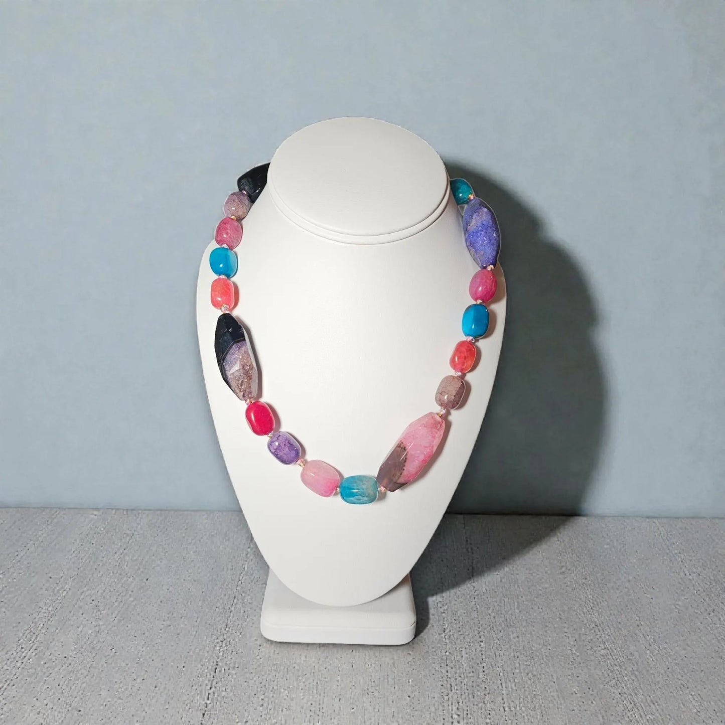 Chunky Multi-Color Agate Necklace handcrafted with vibrant natural agate stones in a bold statement design. This eye-catching jewelry piece combines colorful gemstones for a striking, boho-chic accessory perfect for casual wear, special occasions, or layering with other necklaces. Ideal as a thoughtful gift for women who love handmade statement jewelry, crystal healing properties, and artisan-crafted accessories that blend style, energy, and unique, colorful charm.