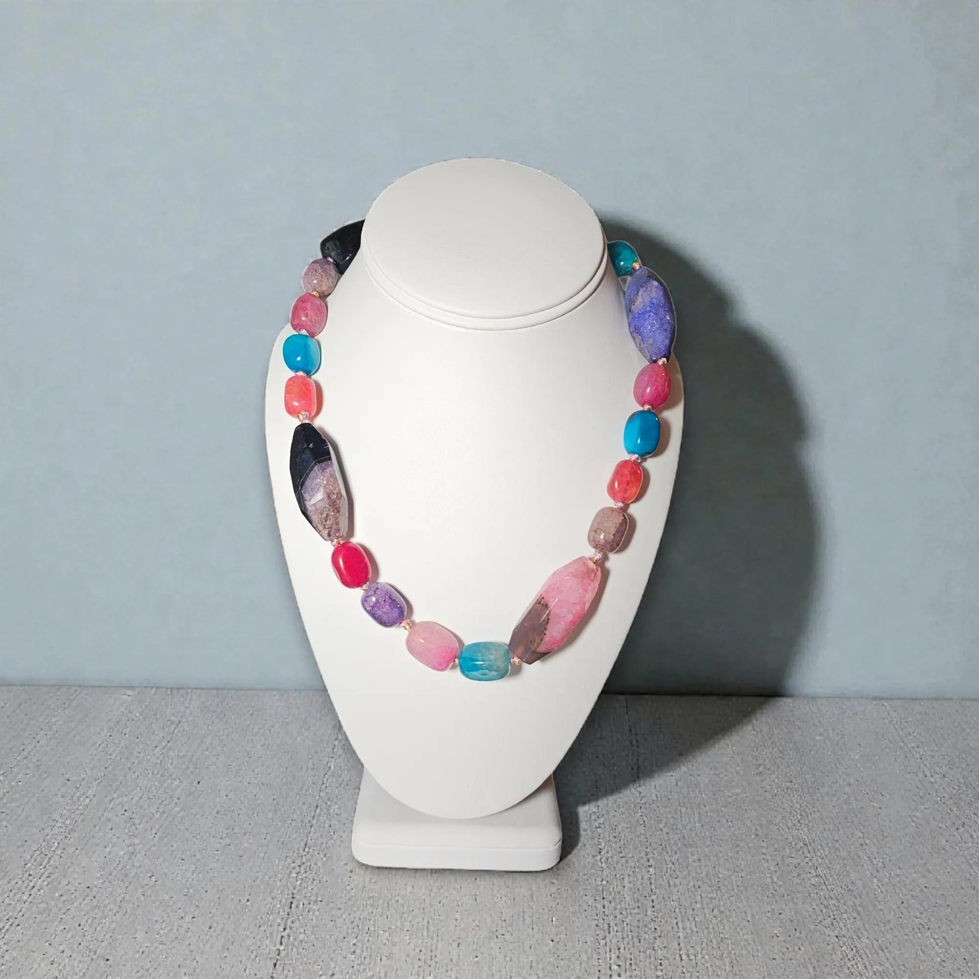 Chunky Multi-Color Agate Necklace handcrafted with vibrant natural agate stones in a bold statement design. This eye-catching jewelry piece combines colorful gemstones for a striking, boho-chic accessory perfect for casual wear, special occasions, or layering with other necklaces. Ideal as a thoughtful gift for women who love handmade statement jewelry, crystal healing properties, and artisan-crafted accessories that blend style, energy, and unique, colorful charm.