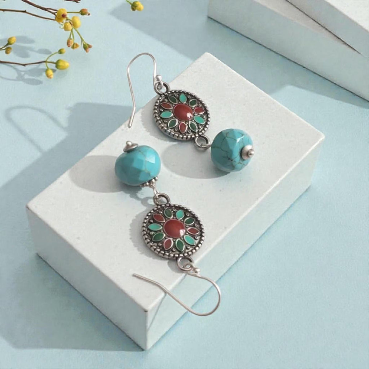 Turquoise Earrings featuring a Southwestern style with vibrant blue stones in a bold, handmade design inspired by Tibetan and Aztec jewelry. These boho statement earrings are perfect for women who love cultural patterns and earthy elegance. Lightweight and eye-catching, they make a meaningful gift for her on birthdays, holidays, or special occasions. A unique accessory that adds rustic charm and artisan style to any outfit.