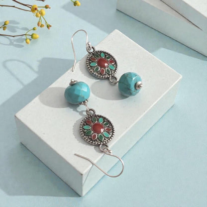 Turquoise Earrings featuring a Southwestern style with vibrant blue stones in a bold, handmade design inspired by Tibetan and Aztec jewelry. These boho statement earrings are perfect for women who love cultural patterns and earthy elegance. Lightweight and eye-catching, they make a meaningful gift for her on birthdays, holidays, or special occasions. A unique accessory that adds rustic charm and artisan style to any outfit.