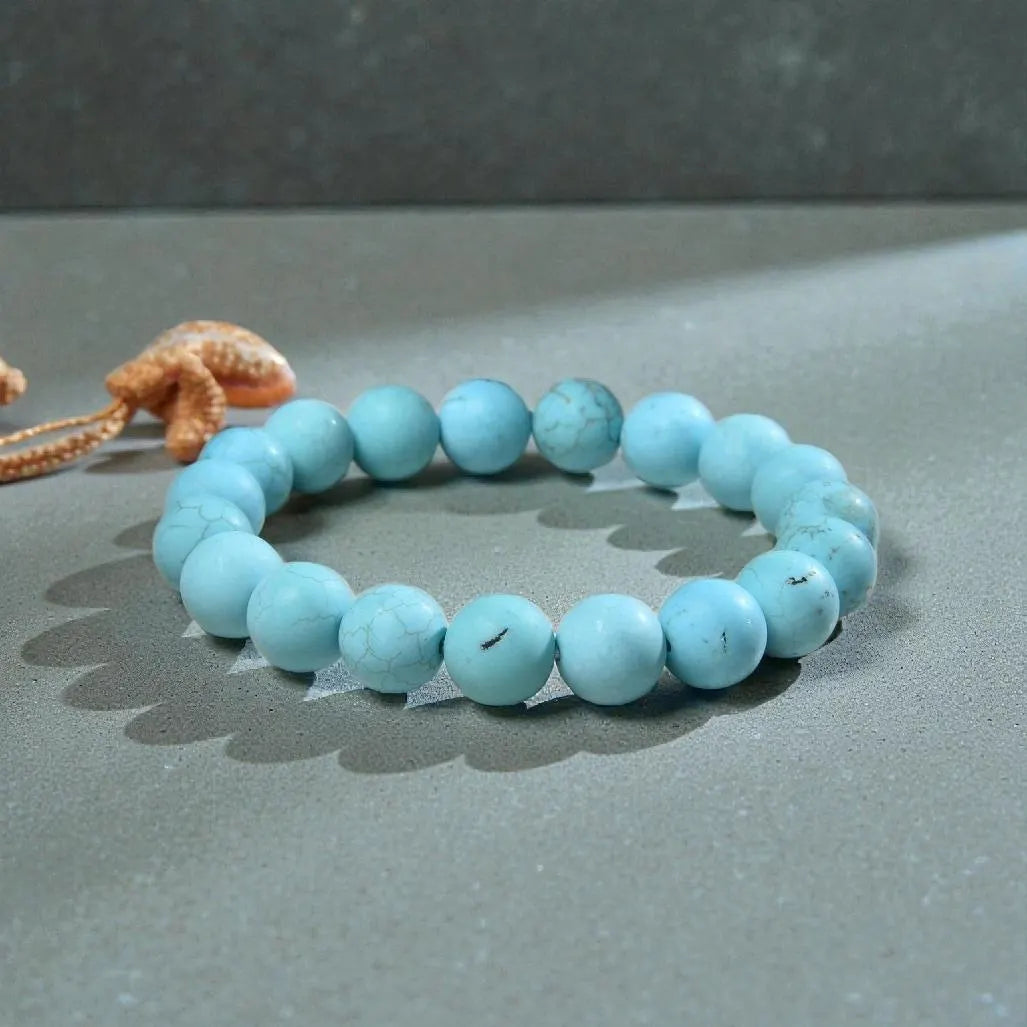 Magnesite Turquoise Stretch Bracelet designed for women and men, featuring blue stone beads known for their healing and chakra-balancing properties. This handcrafted boho crystal jewelry offers both style and spiritual energy, perfect for those seeking natural wellness accessories. Lightweight and comfortable, it makes a thoughtful gift that promotes calmness, positivity, and balance. Ideal for everyday wear, meditation, or adding a vibrant, earthy touch to any outfit.