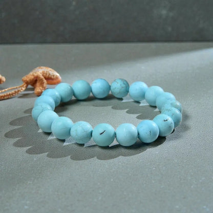 Magnesite Turquoise Stretch Bracelet designed for women and men, featuring blue stone beads known for their healing and chakra-balancing properties. This handcrafted boho crystal jewelry offers both style and spiritual energy, perfect for those seeking natural wellness accessories. Lightweight and comfortable, it makes a thoughtful gift that promotes calmness, positivity, and balance. Ideal for everyday wear, meditation, or adding a vibrant, earthy touch to any outfit.