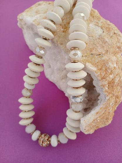 Handmade chunky choker necklace for women featuring a mix of ivory and wood beads, designed in a short statement style. This natural crystal jewelry piece combines earthy tones with bold texture, perfect for adding a boho-chic touch to any outfit. Ideal as a gift for her, the necklace showcases artisan craftsmanship and a unique blend of materials, offering a stylish, organic accessory for casual or dressed-up occasions.