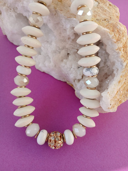 Handmade chunky choker necklace for women featuring a mix of ivory and wood beads, designed in a short statement style. This natural crystal jewelry piece combines earthy tones with bold texture, perfect for adding a boho-chic touch to any outfit. Ideal as a gift for her, the necklace showcases artisan craftsmanship and a unique blend of materials, offering a stylish, organic accessory for casual or dressed-up occasions.