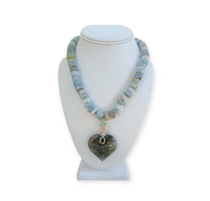Labradorite Pendant Aquamarine Necklace featuring a statement heart-shaped pendant, handcrafted for women who love boho and spiritual jewelry. This unique necklace combines the mystical glow of labradorite with soothing aquamarine stones, creating a meaningful accessory that promotes intuition and calm energy. Perfect as a thoughtful handmade gift for her, it adds elegance and positive energy to any outfit, ideal for everyday wear or special occasions.