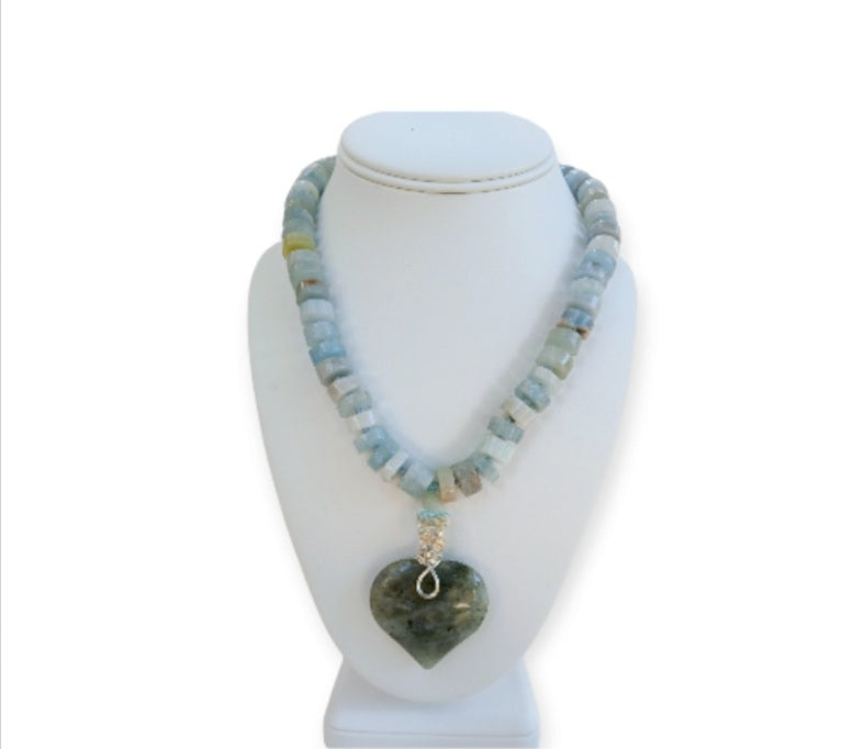 Labradorite Pendant Aquamarine Necklace featuring a statement heart-shaped pendant, handcrafted for women who love boho and spiritual jewelry. This unique necklace combines the mystical glow of labradorite with soothing aquamarine stones, creating a meaningful accessory that promotes intuition and calm energy. Perfect as a thoughtful handmade gift for her, it adds elegance and positive energy to any outfit, ideal for everyday wear or special occasions.