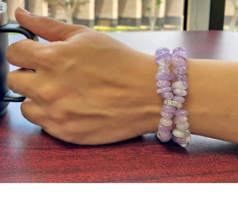 Amethyst Bracelet for Women featuring delicate lavender crystal beads handcrafted into a beautiful healing bracelet. This handmade beaded jewelry piece is designed to promote calm, balance, and spiritual well-being. Suitable as a meaningful gift for both men and women, it blends elegant style with natural energy. Perfect for everyday wear, meditation, or as a thoughtful spiritual accessory, this bracelet highlights the beauty and power of amethyst crystals in a versatile, artisanal design.
