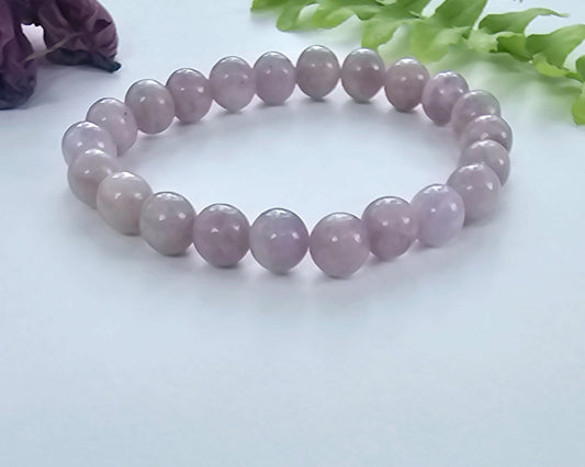 Elegant lavender Jadeite stretch bracelet for women featuring 8mm smooth beads, designed as a lucky healing stone jewelry piece. This adjustable one-size bracelet offers both comfort and style, promoting balance and positive energy. Perfect as a meaningful gift for her, it combines natural beauty and spiritual benefits in a versatile accessory ideal for everyday wear or special occasions, handmade with care.