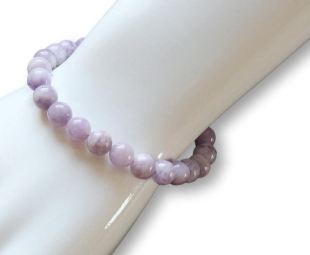 Elegant lavender Jadeite stretch bracelet for women featuring 8mm smooth beads, designed as a lucky healing stone jewelry piece. This adjustable one-size bracelet offers both comfort and style, promoting balance and positive energy. Perfect as a meaningful gift for her, it combines natural beauty and spiritual benefits in a versatile accessory ideal for everyday wear or special occasions, handmade with care.