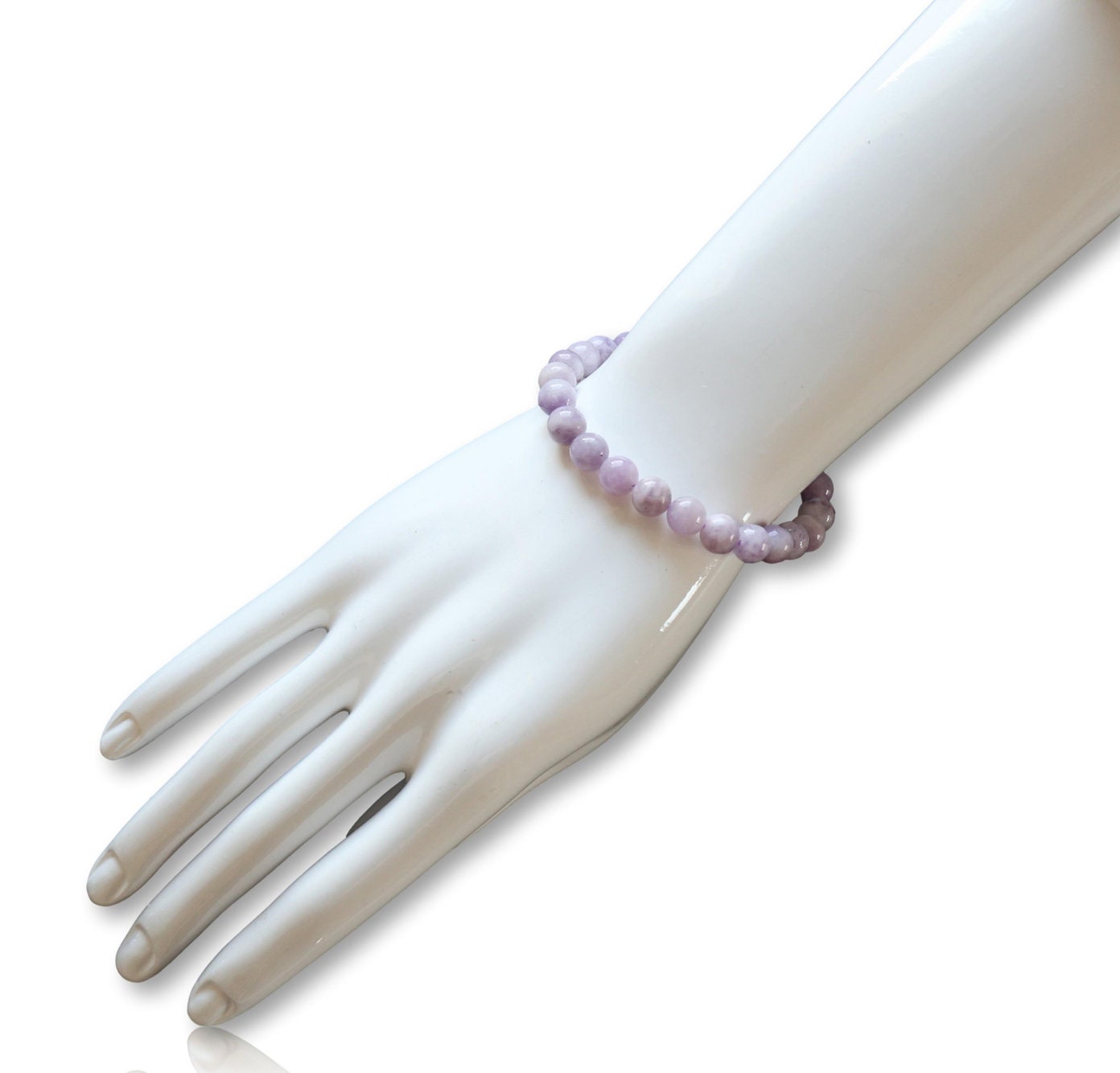 Elegant lavender Jadeite stretch bracelet for women featuring 8mm smooth beads, designed as a lucky healing stone jewelry piece. This adjustable one-size bracelet offers both comfort and style, promoting balance and positive energy. Perfect as a meaningful gift for her, it combines natural beauty and spiritual benefits in a versatile accessory ideal for everyday wear or special occasions, handmade with care.
