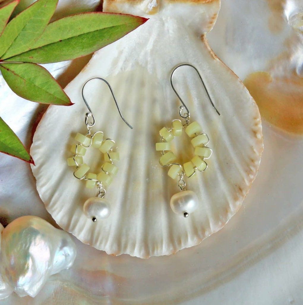 Handmade hoop earrings featuring cultured freshwater pearls and vibrant lemon jade beads, beautifully combining elegance and natural healing properties. These gemstone earrings are perfect for women who appreciate unique, handcrafted jewelry with a touch of boho charm. Ideal as a bridesmaid gift or special occasion accessory, these delicate pearl and jade earrings bring a fresh, stylish look infused with calming crystal energy.