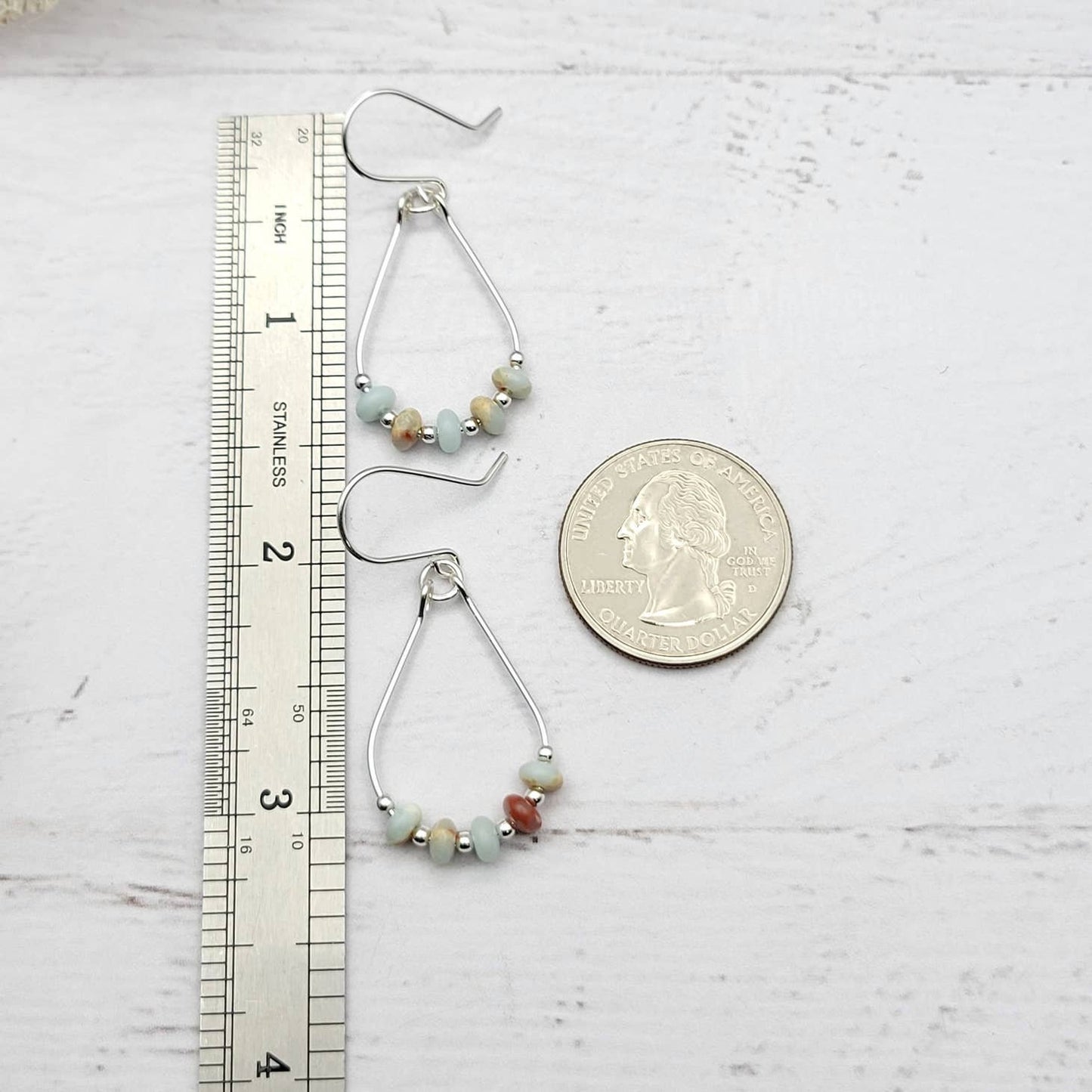Light Blue Jasper Sterling Silver Earrings featuring handmade amazonite teardrop hoops designed for women who love elegant, natural blue jewelry. These artisanal earrings blend soothing jasper and amazonite stones with sterling silver craftsmanship, creating a delicate yet eye-catching accessory. Perfect as a gift for her or a bridesmaid gift, they add a calming, stylish touch to any outfit, ideal for everyday wear or special occasions with a boho-chic flair.