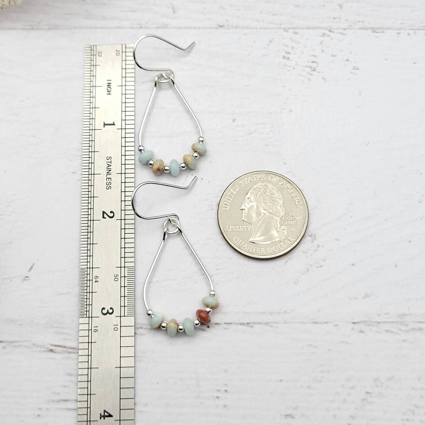 Light Blue Jasper Sterling Silver Earrings featuring handmade amazonite teardrop hoops designed for women who love elegant, natural blue jewelry. These artisanal earrings blend soothing jasper and amazonite stones with sterling silver craftsmanship, creating a delicate yet eye-catching accessory. Perfect as a gift for her or a bridesmaid gift, they add a calming, stylish touch to any outfit, ideal for everyday wear or special occasions with a boho-chic flair.