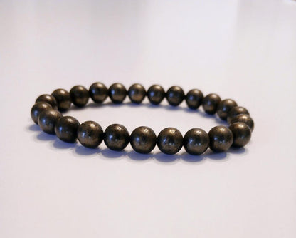 Good Luck Pyrite Bracelet featuring handmade crystal beads designed to attract abundance and positive spiritual energy. This unisex bracelet combines shimmering pyrite stones with artisanal craftsmanship, making it a meaningful gift for both women and men. Lightweight and stylish, it promotes confidence, prosperity, and protection. Perfect for everyday wear or meditation, this abundance bracelet blends healing properties with modern boho jewelry aesthetics.