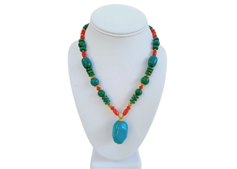 Handmade chunky Southwest style necklace featuring vibrant magnesite, turquoise, coral, and azurite stones. This bold statement jewelry piece combines natural gemstones with boho flair, perfect for women who love eye-catching accessories. Ideal as a unique gift for her, the necklace highlights colorful, handcrafted craftsmanship that complements casual and festive outfits with a striking, earthy vibe.