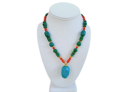 Handmade chunky Southwest style necklace featuring vibrant magnesite, turquoise, coral, and azurite stones. This bold statement jewelry piece combines natural gemstones with boho flair, perfect for women who love eye-catching accessories. Ideal as a unique gift for her, the necklace highlights colorful, handcrafted craftsmanship that complements casual and festive outfits with a striking, earthy vibe.