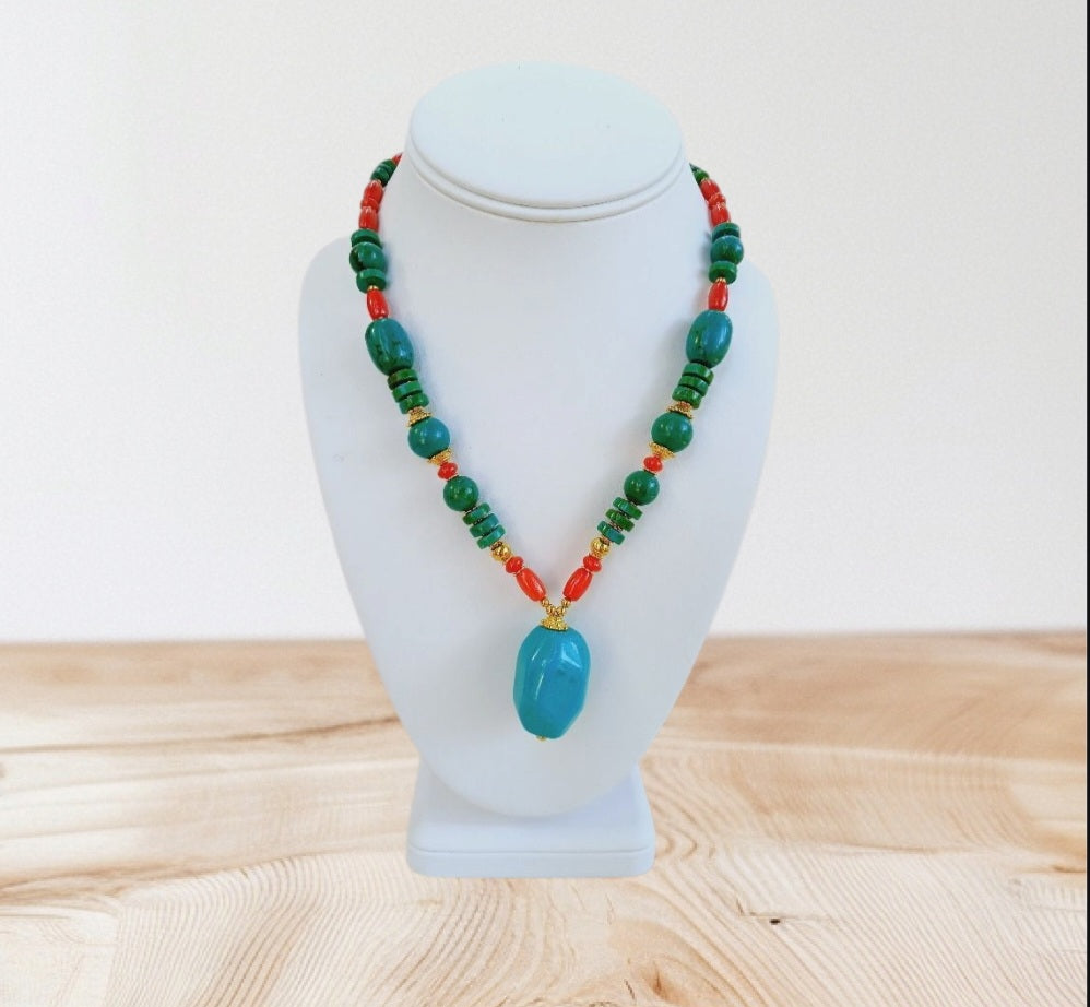Handmade chunky Southwest style necklace featuring vibrant magnesite, turquoise, coral, and azurite stones. This bold statement jewelry piece combines natural gemstones with boho flair, perfect for women who love eye-catching accessories. Ideal as a unique gift for her, the necklace highlights colorful, handcrafted craftsmanship that complements casual and festive outfits with a striking, earthy vibe.