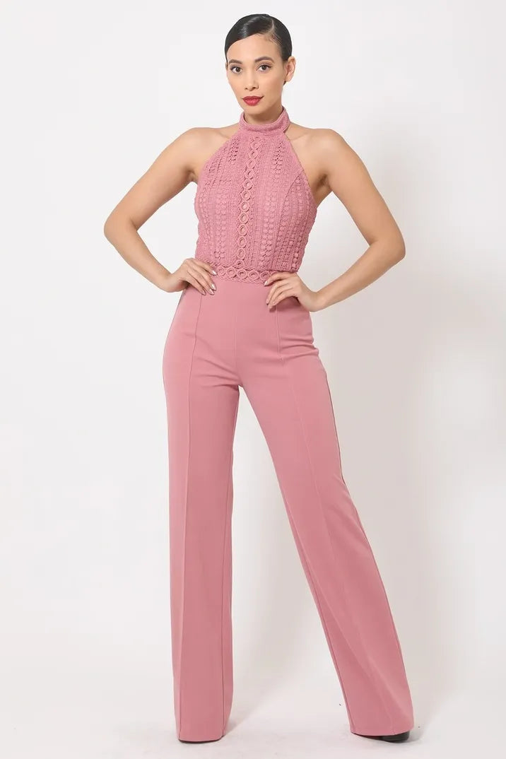 Mauve sleeveless halter neck jumpsuit for women featuring a crochet top and open back design crafted from soft knit fabric. This elegant summer romper offers a flattering silhouette ideal for parties and special occasions. The breathable material ensures comfort while maintaining a stylish look. Recommended hand wash care helps preserve the fabric’s quality and delicate crochet details, making it a chic and sophisticated outfit choice.