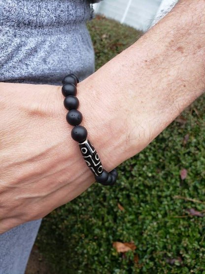 Black Onyx Bracelet with Tibetan Agate accents featuring 10mm stretch beads designed for men who appreciate spiritual healing and stylish jewelry. This handcrafted bracelet combines powerful black onyx stones with earthy agate for balance, protection, and grounding energy. Ideal as a meaningful gift for him, it blends durability and comfort with a sleek, masculine design—perfect for everyday wear, meditation, or enhancing personal style with natural healing properties.
