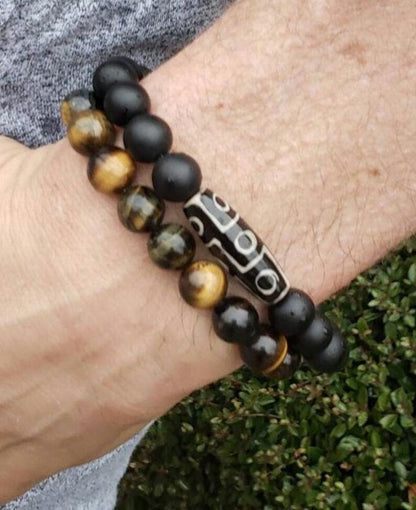 Black Onyx Bracelet with Tibetan Agate accents featuring 10mm stretch beads designed for men who appreciate spiritual healing and stylish jewelry. This handcrafted bracelet combines powerful black onyx stones with earthy agate for balance, protection, and grounding energy. Ideal as a meaningful gift for him, it blends durability and comfort with a sleek, masculine design—perfect for everyday wear, meditation, or enhancing personal style with natural healing properties.