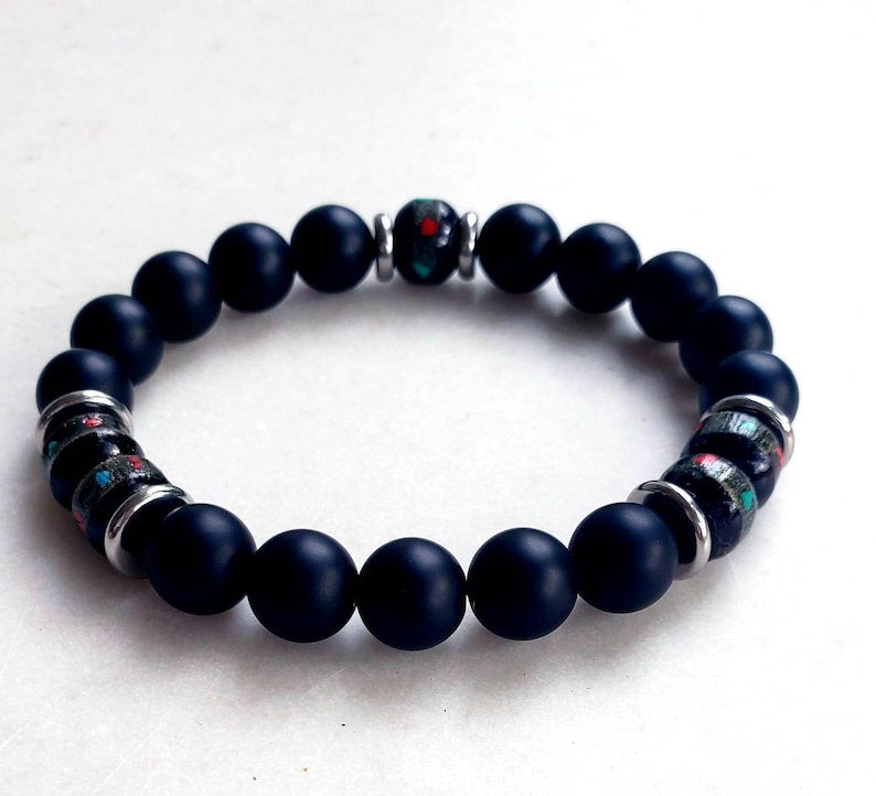 Handcrafted Onyx Bracelet for Men featuring yak bone, natural stone, and black lava beads. This minimalist Tibetan protection bracelet offers spiritual grounding and energy balance. Stylish yet meaningful, the black charm jewelry makes a unique handmade gift for men. Ideal for daily wear or special occasions, it combines tradition and modern design. Perfect men’s accessory for wellness, mindfulness, and style.