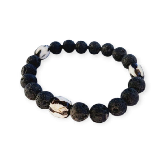 Tibetan Bone Bracelet with 12mm black lava stone beads, designed as a stretch diffuser bracelet for meditation and grounding. This handmade men’s bracelet combines traditional Tibetan jewelry elements with natural lava stones, perfect for essential oils. A meaningful lucky charm and spiritual accessory, ideal for promoting calm and focus. Great handmade gift for him—perfect for yoga, wellness, or daily wear with intention and style.