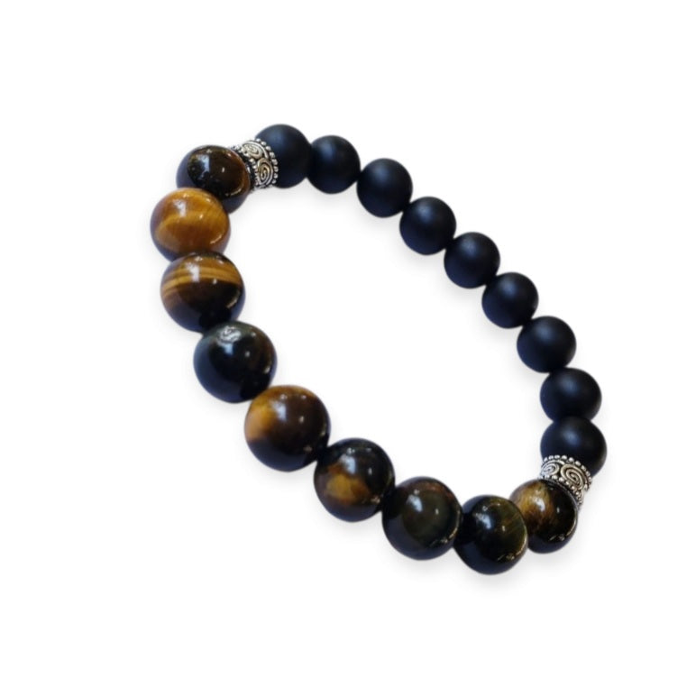 Handmade men’s bracelet featuring natural tiger’s eye and black onyx stones set in a sleek sterling silver bar design. This stylish accessory combines powerful lucky charm stones, known for their protective and grounding properties, making it an ideal birthday gift or meaningful jewelry piece. Perfect for men who appreciate handcrafted, elegant, and masculine jewelry that blends natural elements with modern style.