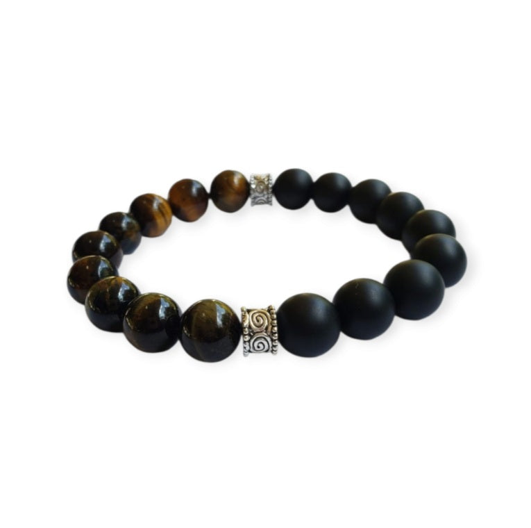 Handmade men’s bracelet featuring natural tiger’s eye and black onyx stones set in a sleek sterling silver bar design. This stylish accessory combines powerful lucky charm stones, known for their protective and grounding properties, making it an ideal birthday gift or meaningful jewelry piece. Perfect for men who appreciate handcrafted, elegant, and masculine jewelry that blends natural elements with modern style.
