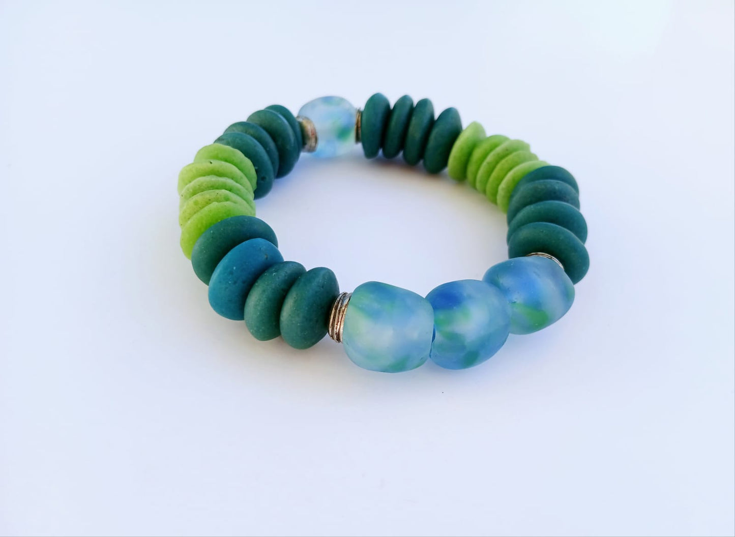 Multi Color Ashanti Blue Green Glass Beaded Bracelet featuring vibrant, handcrafted African trade beads in a bold, spiritual design. This colorful boho statement bracelet is inspired by traditional Ashanti craftsmanship, blending rich cultural heritage with modern style. Perfect handmade jewelry gift for women who love unique, meaningful accessories. Ideal for birthdays, holidays, or special occasions. A stunning piece full of color, energy, and artisan charm.