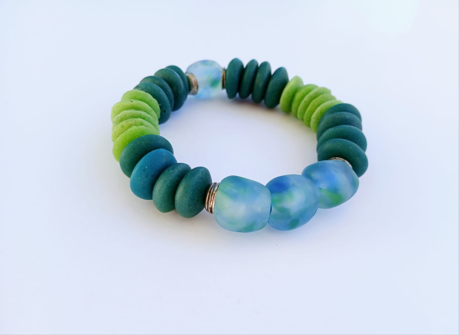 Multi Color Ashanti Blue Green Glass Beaded Bracelet featuring vibrant, handcrafted African trade beads in a bold, spiritual design. This colorful boho statement bracelet is inspired by traditional Ashanti craftsmanship, blending rich cultural heritage with modern style. Perfect handmade jewelry gift for women who love unique, meaningful accessories. Ideal for birthdays, holidays, or special occasions. A stunning piece full of color, energy, and artisan charm.