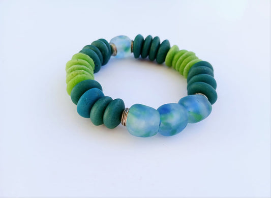 Multi Color Ashanti Blue Green Glass Beaded Bracelet featuring vibrant, handcrafted African trade beads in a bold, spiritual design. This colorful boho statement bracelet is inspired by traditional Ashanti craftsmanship, blending rich cultural heritage with modern style. Perfect handmade jewelry gift for women who love unique, meaningful accessories. Ideal for birthdays, holidays, or special occasions. A stunning piece full of color, energy, and artisan charm.